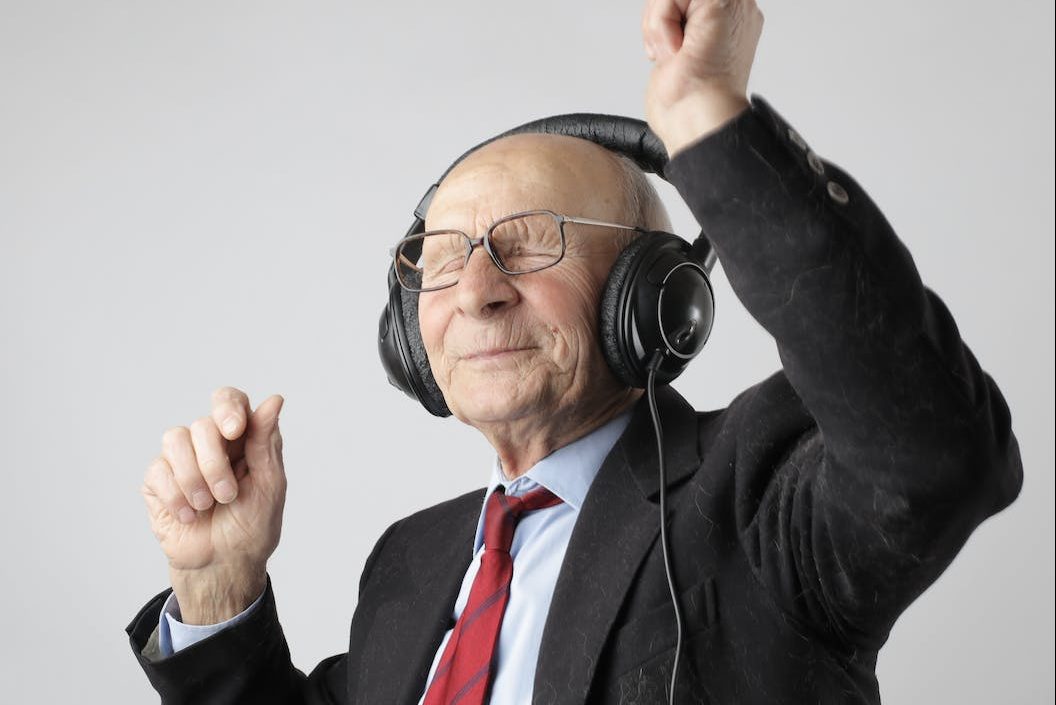 man in black jacket wearing black headphones